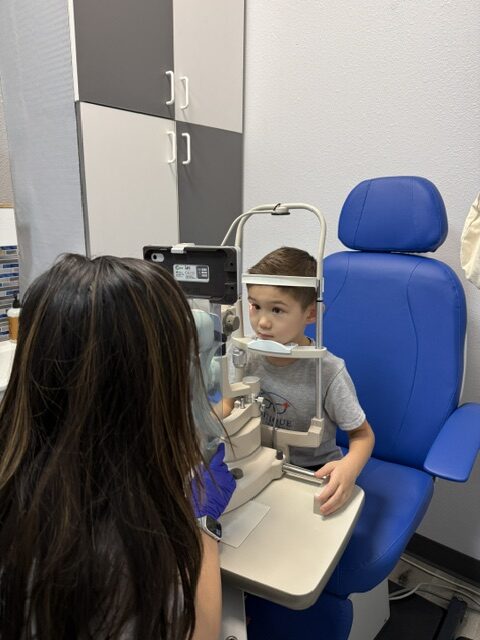 Child attending an eye examination at Buitique Optometry