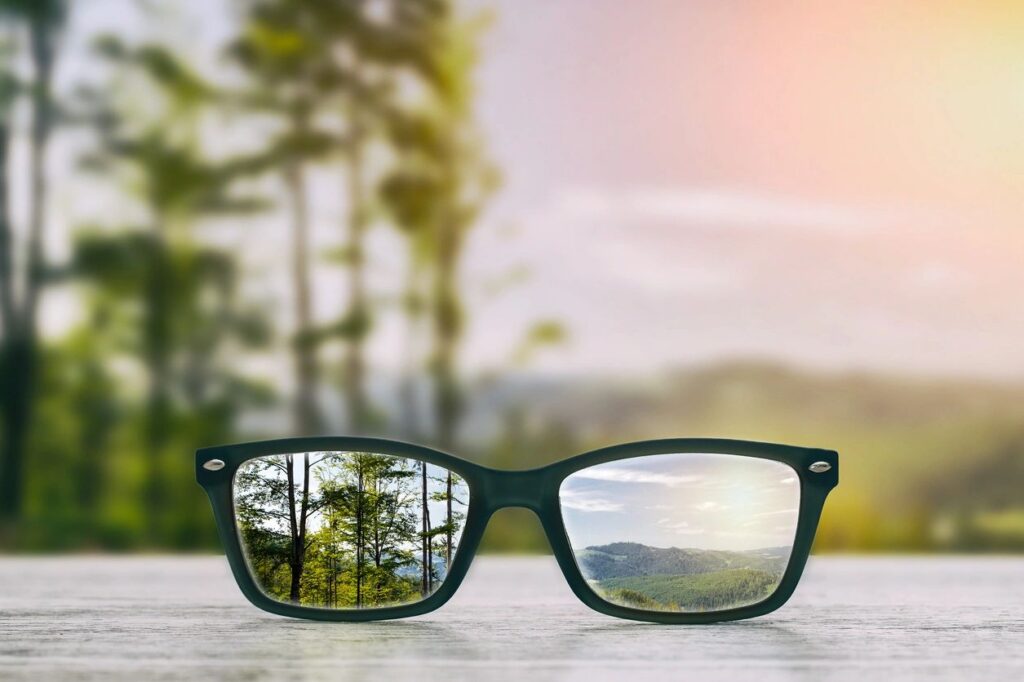 Eyeglasses resting outdoors, representing comfortable vision and screen-use eye care
